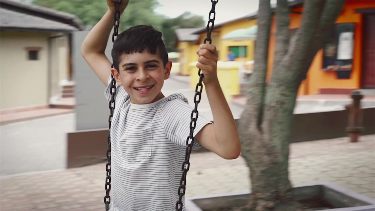 Boy on a swing, frame from Takeover